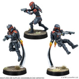 Three action figure miniatures on stands with a white background