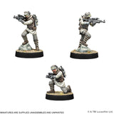 Three miniature figures of characters in tactical gear on a white background, with Lucasfilm Ltd. branding.