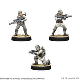 Three miniature figures in star wars costume on a white background