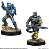 Two miniature figures on bases with detailed armor and weapons, featuring branding.