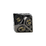 Metallic dice with gold numbering on a white background