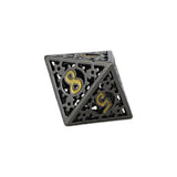Decorative metal dice with intricate patterns and gold symbols on a white background