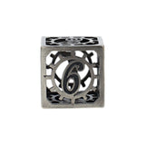 Decorative metal cube with number 6 on a white background