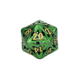 Green polyhedral dice with gold numbers on a white background