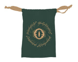 A dark green drawstring pouch featuring a circular gold emblem in the center with a leaf-like symbol inside, surrounded by gold Elvish script. The pouch has two tan rope ties at the top and is shown against a plain white background.