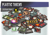 Collection of plastic tokens with various designs on a gray background
