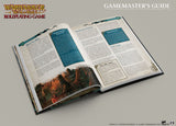 Open book titled 'Warhammer: The Old World Roleplaying Game Gamemaster's Guide' on a gray background