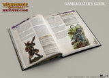 Open book titled 'Warhammer The Old World Roleplaying Game Gamemaster's Guide' on a gray background