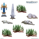 Collection of miniature game pieces with 'StarCraft' branding on a white background