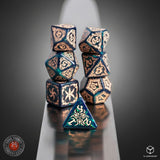 Decorative dice set with intricate designs on a reflective surface