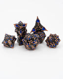 Set of polyhedral dice with blue and bronze design on a white background