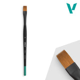 Paintbrush with black and green handle on a white background