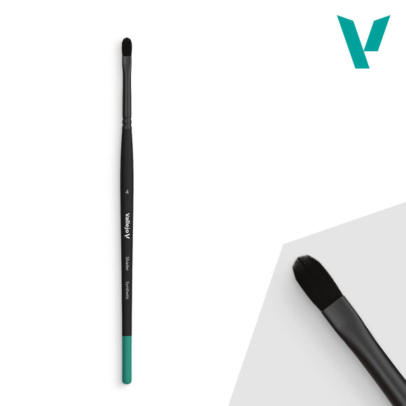 Black makeup brush with green accent on a white background