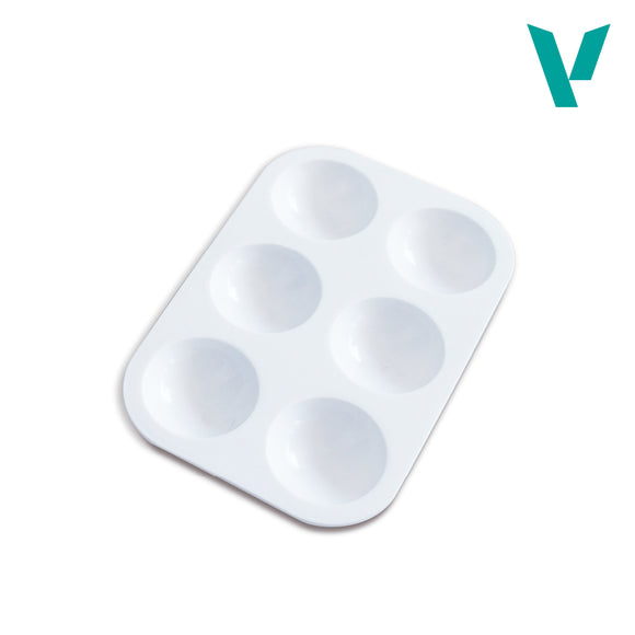 White plastic paint tray on a light gray background