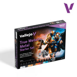 Vallejo True Metallic Metal Starter Set box in Fantasy Color Series, featuring fantasy armor artwork and a row of paint tubes along the bottom, shown on a white background with a purple Vallejo logo in the top right corner.