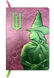 Notebook with green witch design on a pink embossed cover