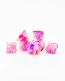 Set of pink and clear dice with numbers on a white background