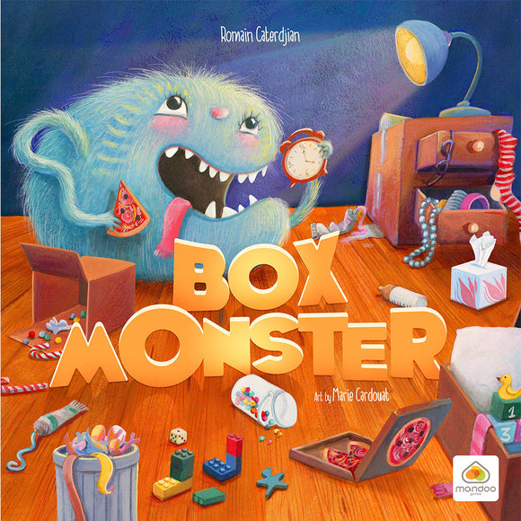 Box Monster, Art by marie Cardouat. The box art features a fuzzy blue monster devouring a box of candy and pizza, the remains are scattered amongst the floor and a messy nightstand with the lamp pointed towards the monster illuminating the piece.